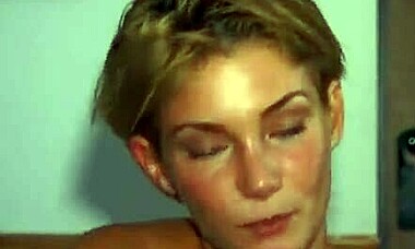 Hey, wanna see this tanned redhead take two huge cocks in a garage threesome?