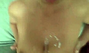 Homemade clip shows amateur girlfriend getting cum splashed on her big tits