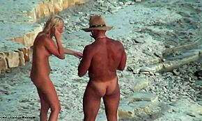 Hey, ever seen a sexy tanned couple completely naked chilling on the beach?