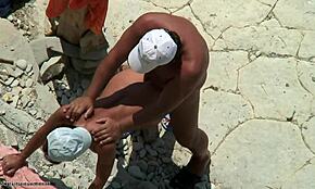 Bronzed Beauty Bends Over for Doggystyle on Beach, Caught on Hidden Cam!