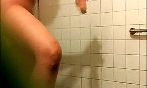 Gorgeous babe reveals tight pussy in steamy shower scene