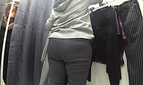 a plump russian milf's juicy ass in white panties. big tits in a bra caught on hidden camera in public dressing room.