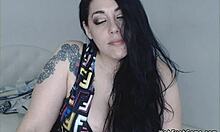 Blue-eyed brunette masturbates huge tits on webcam