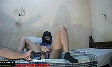 Why is Roxana moaning as she slides her pink dildo into her wet pussy?