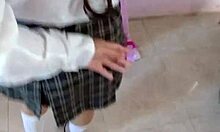 Is this schoolgirl undressing in the hotel?