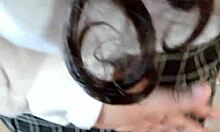 Is this schoolgirl undressing in the hotel?