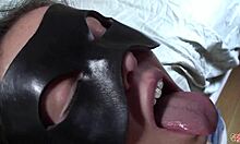 Naughty Woman Behind Mask Receives Intense Facial Cumshot