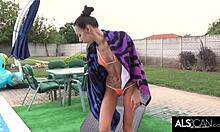 Sultry brunette plays with toy after pool swim