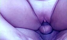 In the backyard, a guy with a monster cock fills his girlfriend's pussy while she rides him hard, leading to a creampie.
