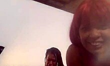 Ebony couple engages in intimate foot play on webcam with friend watching.