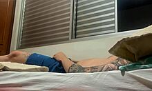 Intriguing solo amateur strokes his tattooed cock alone.