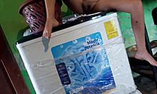 Curious latina girl washing clothes and smelling boxers