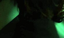 amateur latina poses in front of mirror with black dress