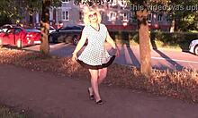Cute milf's upskirt on street reveals shaved pussy.