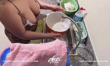 I caught my Indian bhabi washing dishes, showing off her natural tits in the kitchen.