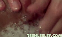 teen lesley takes a bath and starts fingering her pussy, masturbating slowly.