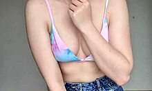 Teen in skirt and swimsuit bra shows off