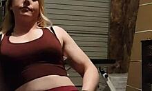 The muscular gym girl performs a teasing striptease