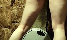 The muscular gym girl performs a teasing striptease