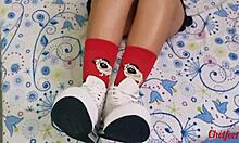 girlfriend tempts with shoes and red socks, gives foot massage until climax