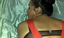 Woman In Red Dress Prepares For Evening Out