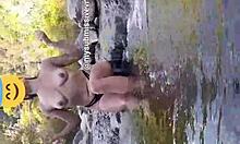 Brunette exhibitionist bathes in river naked