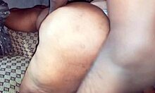 Chubby black lady shows her wide ass.