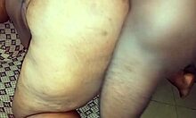 Chubby black lady shows her wide ass.