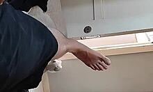 Look at this close-up of a big dick and feet!