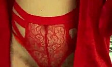 Brunette in red lingerie plays with herself