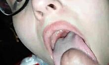 This beautiful brunette is sucking her boyfriend's big black cock so eagerly