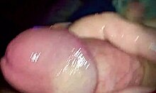 Amateur close-up of oiled handjob on large penis