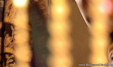 Mature brunette actress strips and rips clothes