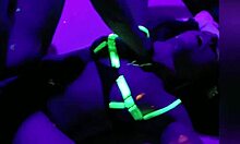 Italian couple dances intimately in crowded club.