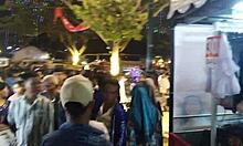 Walking alone to the crowd of people