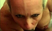 Mature milf with big tits sucks big black cock and gets facial.