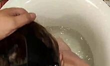 masked brunette gags on cock in bathroom doggystyle and cumshot
