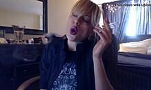 Sandi lights up 3 brown cork cigarettes, smoking seductively while teasing with her big tits.