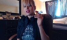 Sandi lights up 3 brown cork cigarettes, smoking seductively while teasing with her big tits.