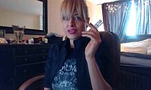 Sandi lights up 3 brown cork cigarettes, smoking seductively while teasing with her big tits.