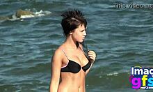 Hot Brunette in Lingerie Sucks Pussy on Beach