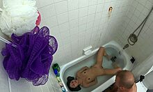 candy cruise relaxes in bathtub scene