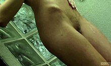 I watch this frisky babe washing her naked boddy.