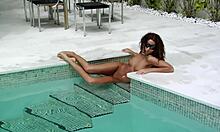 Is that curly girl posing naked in the pool?