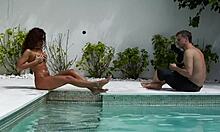 Is that curly girl posing naked in the pool?