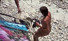 Tanned Naked Beauty Helps Boyfriend On Beach