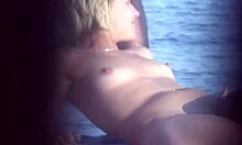 Short-Haired Blonde Flaunts Her Naked Body on a Crowded Nudist Beach