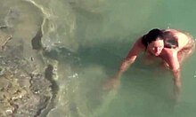 Horny Brunette Moans as Ocean Waves Pound Her Body!