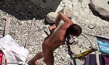 Dark-Haired Babe Grabbing Her Stuff on Nudist Beach.