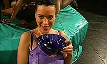 busty brunette enjoys bukkake breakfast on her knees